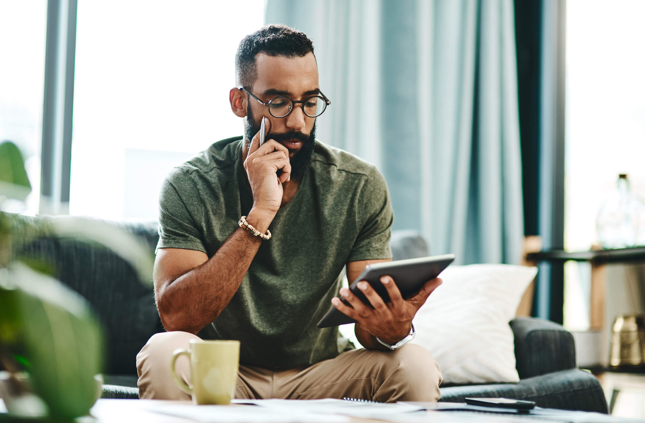 Man holding tablet and reading